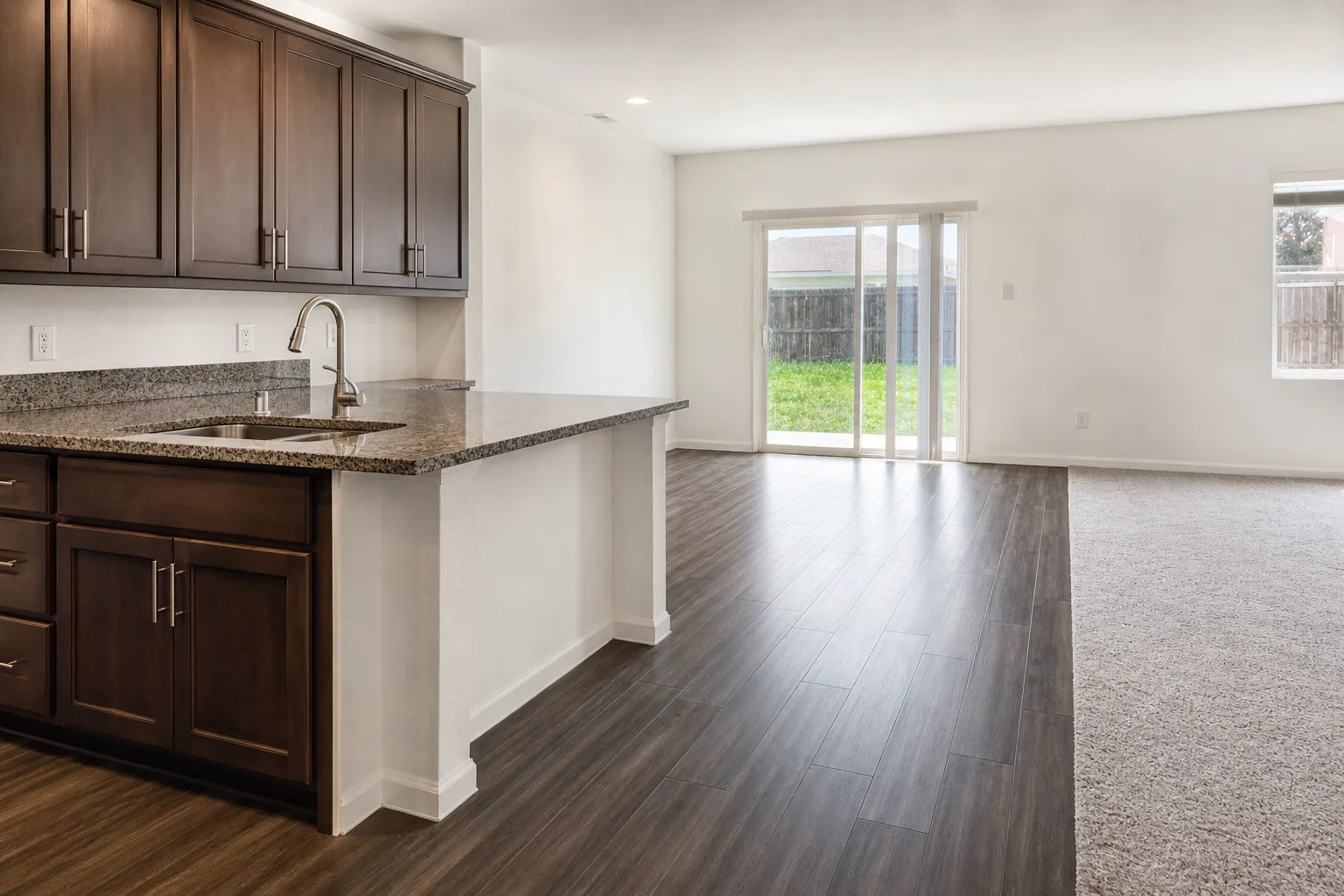 Kitchen flooring flowing into the living area