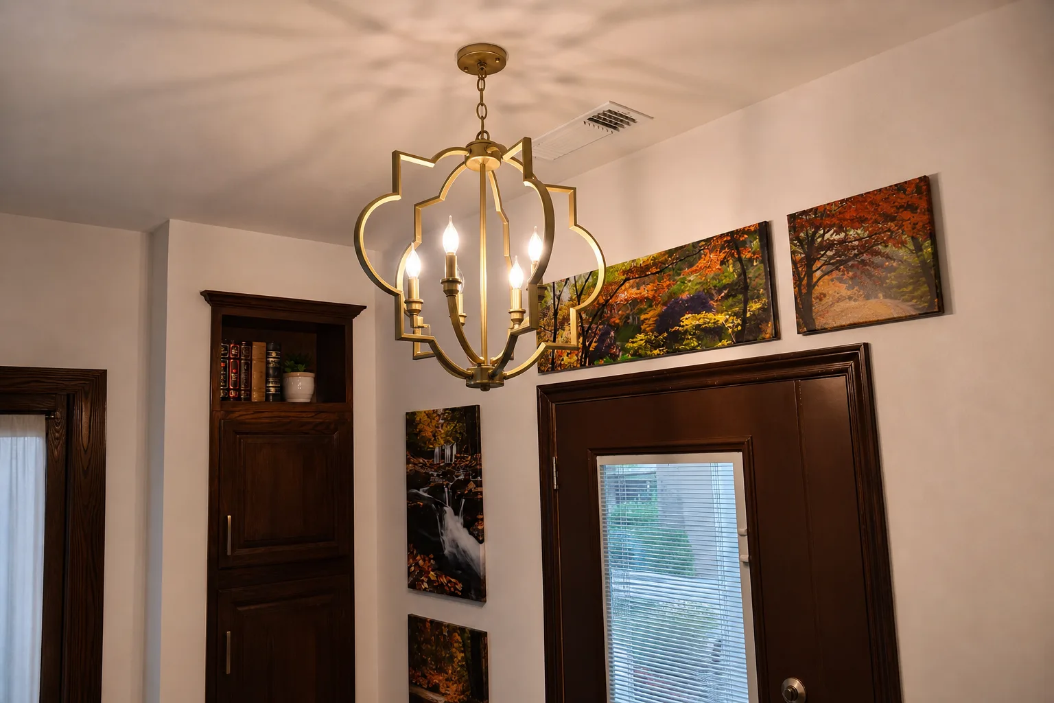 Quatrefoil brass pendant in a reading nook